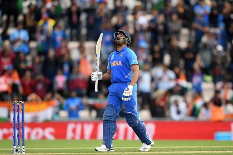 Rohit looks to the sky after completing his century