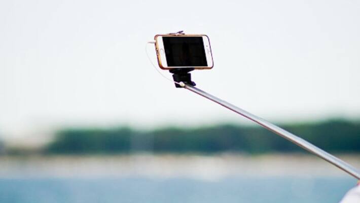 Teacher gets suspended after selfie with woman Teacher gets suspended after selfie with woman