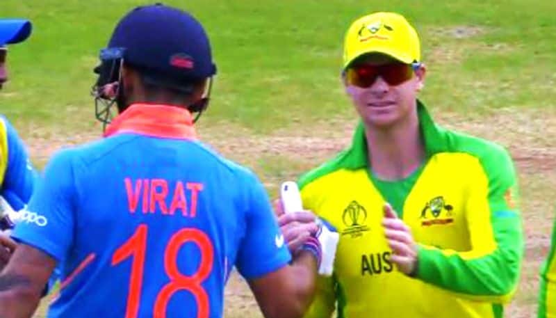 Kohli and Steve Smith shake hands during the match after the former stopped Indian fans from booing the Australian
