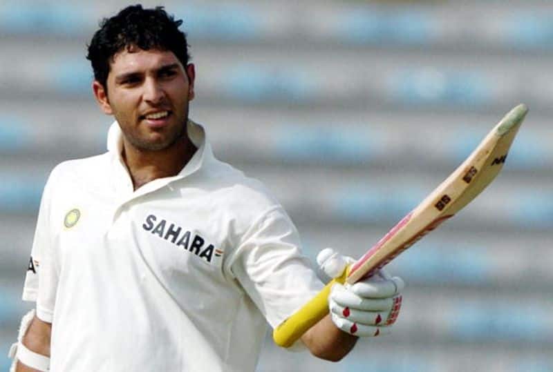 Yuvraj raises his bat after his century during the first day of the second Test match between Pakistan and India at the Gaddafi stadium in Lahore, April 5, 2004.