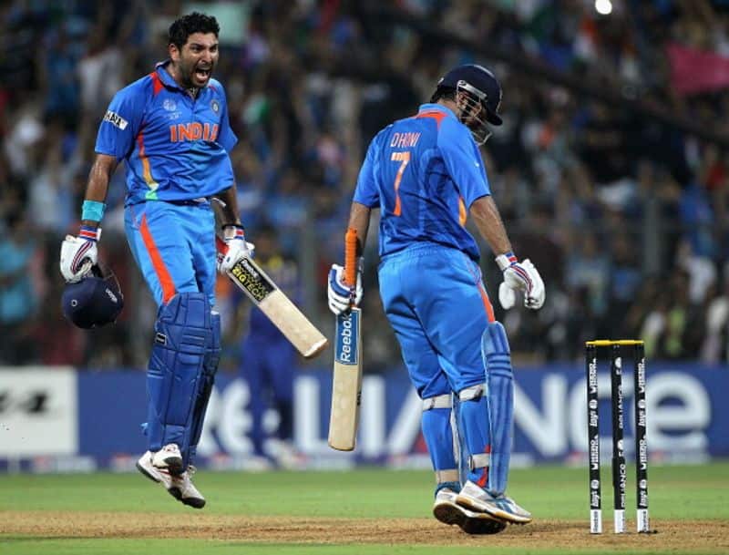 Yuvraj and Dhoni celebrate India's 2011 World Cup final win in Mumbai