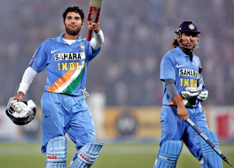 Yuvraj and Dhoni walk off after winning an ODI game for India against Pakistan in Lahore in 2006
