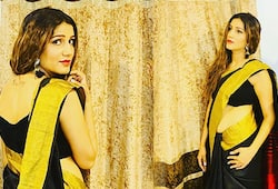 SAPNA CHOUDHARY PICTURES IN BLACK SAREE