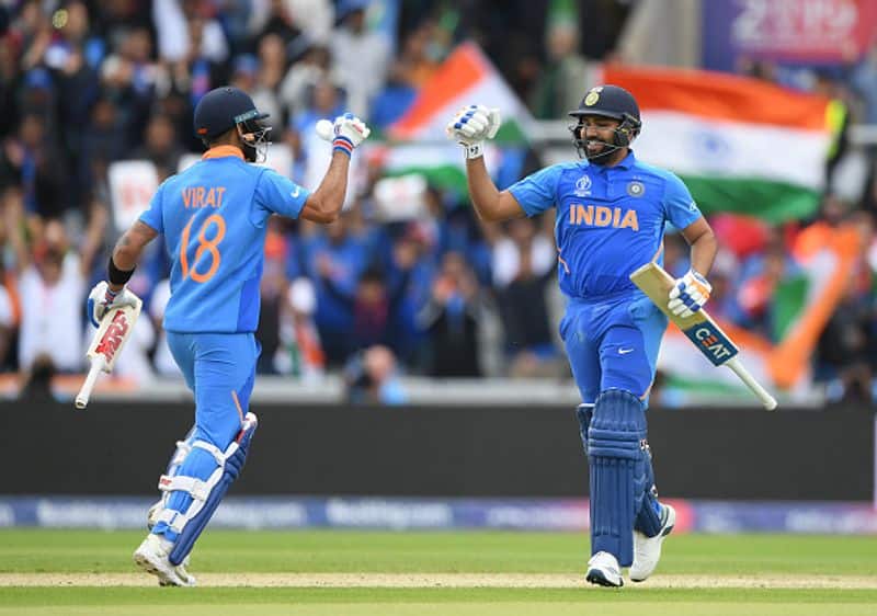 Rohit and Virat Kohli get ready to punch the gloves as the former runs to complete his century