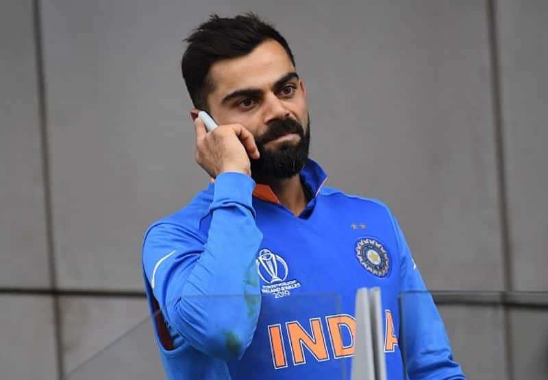 India captain Kohli is on the phone after the victory