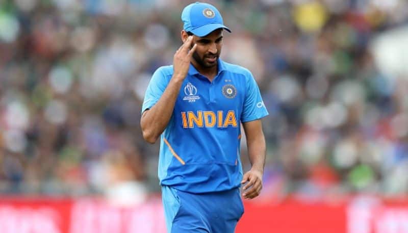 Bhuvneshwar Kumar walks off the ground due to a hamstring injury. He bowled only 2.4 overs. He will miss at least three matches, Kohli said