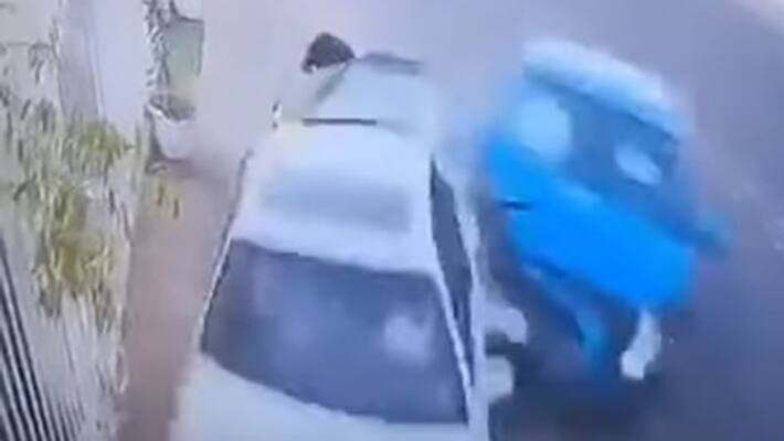 Man narrowly escapes from a speeding car Man narrowly escapes from a speeding car