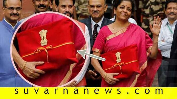 Budget copies in red cloth good bye to briefcase symbolises slavery of Western thought Budget copies in red cloth good bye to briefcase symbolises slavery of Western thought