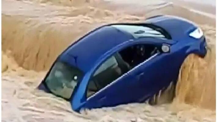 car washed away in heavy flood in ambikapur, chhattisgarh car washed away in heavy flood in ambikapur, chhattisgarh