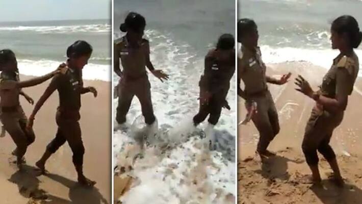 2 lady police dance at beach 2 lady police dance at beach