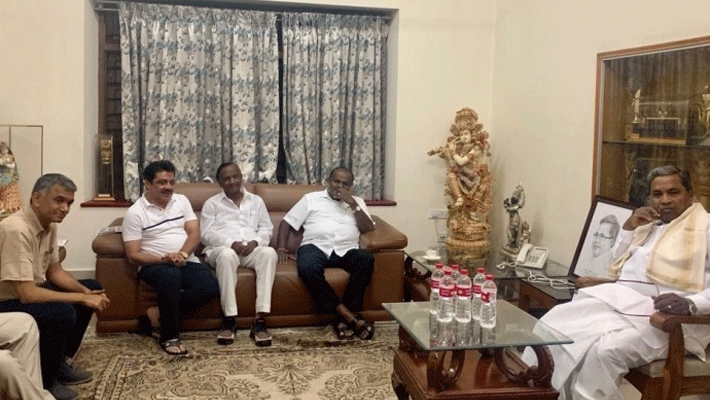 Rebel Congress MLA MTB Nagaraj arrives at Mumbai airport with BJP leader R Ashok Rebel Congress MLA MTB Nagaraj arrives at Mumbai airport with BJP leader R Ashok