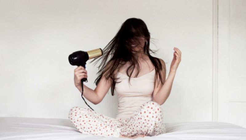 
Don't use a hair dryer
It is advised not to use a hair dryer. It won't really help, and rather damages the device further. You can rather take a hand towel and pat it dry, before dropping it in a jar of rice.
