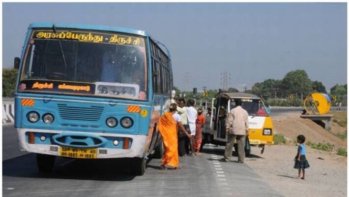 Road buses parked in the middle of the road Passengers suffering from rain and sun Road buses parked in the middle of the road Passengers suffering from rain and sun