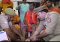 UP police officers are serving kawad yatris in Varanasi