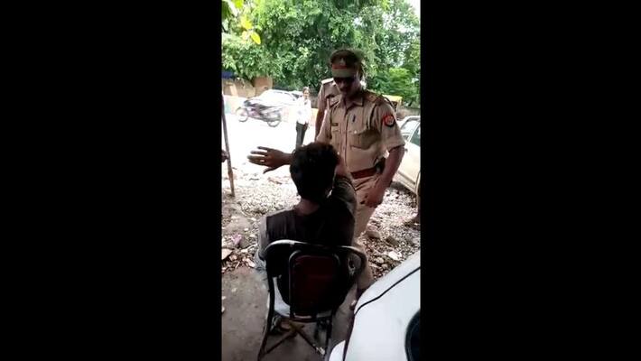 a boy gets beatenup by SI for asking his mobile number a boy gets beatenup by SI for asking his mobile number
