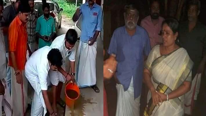 Kerala Youth Congress leaders purify PWD office with cow dung after Dalit MLA's protest, FIR filed Kerala Youth Congress leaders purify PWD office with cow dung after Dalit MLA's protest, FIR filed