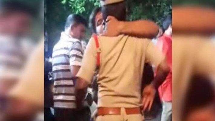 Viral video of Telangana man kissing cop Viral video of Telangana man kissing cop