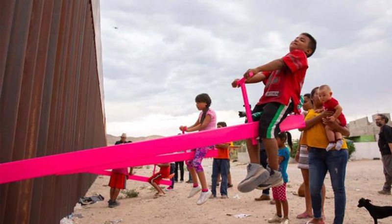 California professor install seesaws along U S Mexico border wall