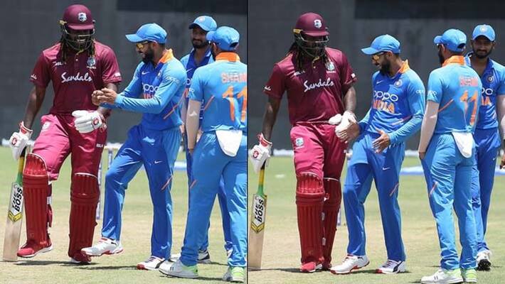 Team India Cricket Captain Virat Kohli dances with Chris Gayle during rain break in 1st ODI Team India Cricket Captain Virat Kohli dances with Chris Gayle during rain break in 1st ODI