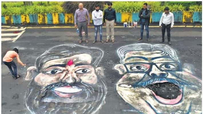 increased accidents due to pits in mumbai;people protest like this increased accidents due to pits in mumbai;people protest like this