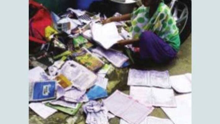 Shivamogga girl breaksdown after her school book lost in flood water Shivamogga girl breaksdown after her school book lost in flood water