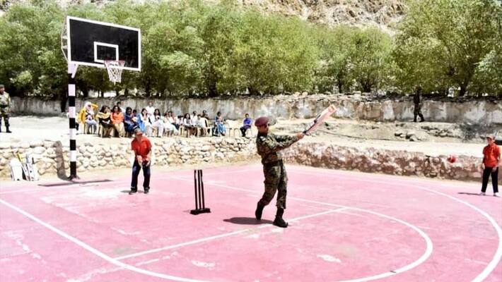 lieutenant colonel ms dhoni plays cricket with leh kids during Indian army service lieutenant colonel ms dhoni plays cricket with leh kids during Indian army service