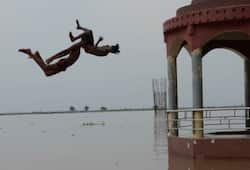 local boys are jumping in ganga river in varanasi