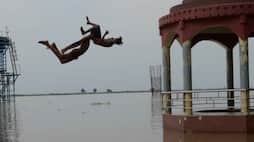 local boys are jumping in ganga river in varanasi