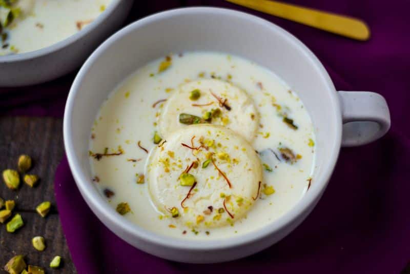 Rasamalai is a dessert recipe is made using milk, dry fruits and paneer. You can garnish the dish with a few strands of kesar.