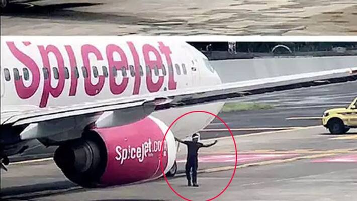 Video goes viral of a crazy man touching aeroplane at Mumbai airport Video goes viral of a crazy man touching aeroplane at Mumbai airport