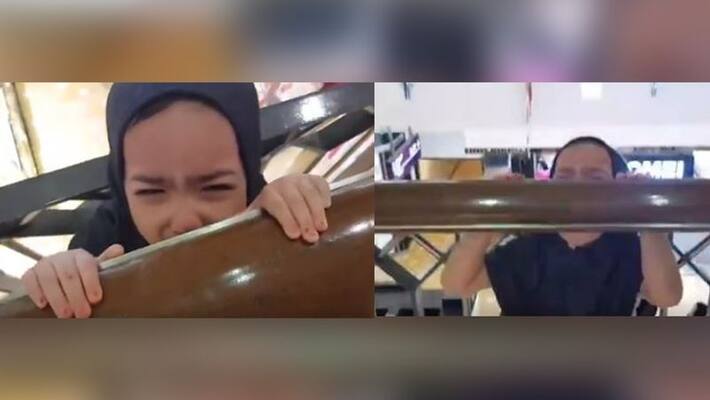 4 years old child stuck her head between shopping mall railing 4 years old child stuck her head between shopping mall railing