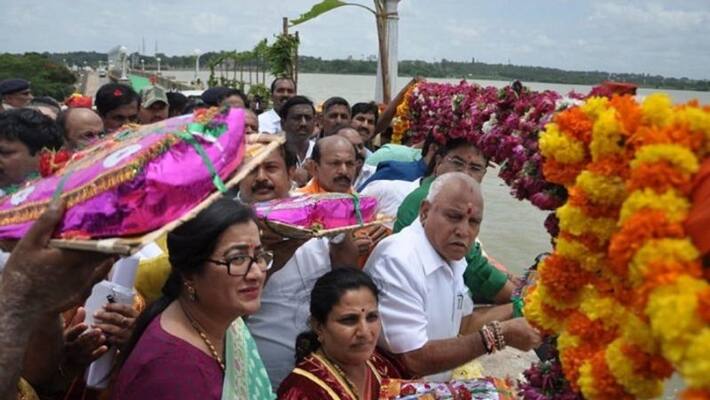 cm Yediyurappa offers bagina to kaveri river in mandya cm Yediyurappa offers bagina to kaveri river in mandya