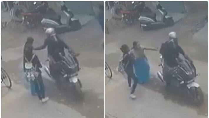 woman thrashed a chain-snatcher woman thrashed a chain-snatcher