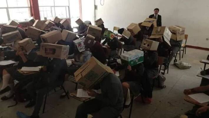 Teacher makes students wear cardboards to stop cheating in exams Teacher makes students wear cardboards to stop cheating in exams