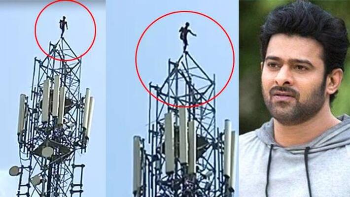 Fan Climbs Cellphone Tower For Prabhas Fan Climbs Cellphone Tower For Prabhas