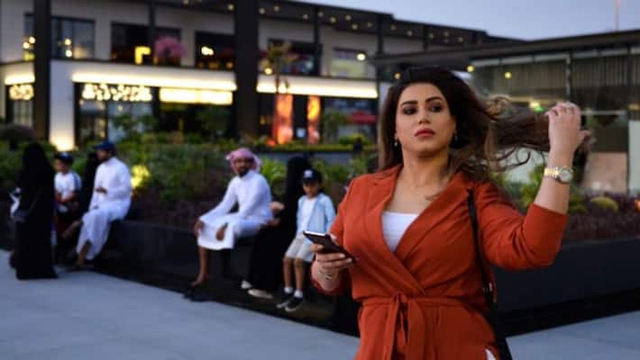 Rebel Saudi women walks through a Riyadh mall without obligatory abaya robe Rebel Saudi women walks through a Riyadh mall without obligatory abaya robe