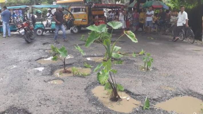 People stopped traffic for bad road condition People stopped traffic for bad road condition