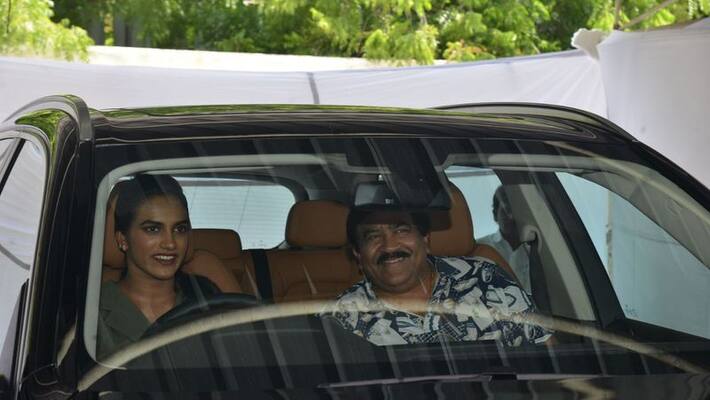 Nagarjuna presents BMW car to PV Sindhu Nagarjuna presents BMW car to PV Sindhu