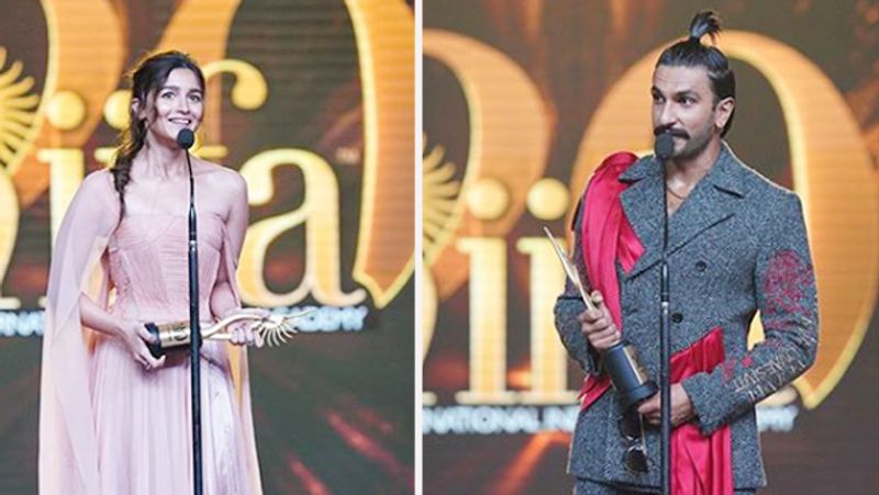 IIFA 2019 के स्टेज पर बेस्ट एक्टर और एक्ट्रेस का अवॉर्ड लेते रणवीर सिंह और आलिया भट्ट। इस दौरान रणवीर के लुक ने सभी का ध्यान आकर्षित किया।
