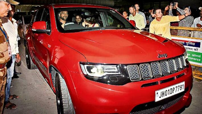 mahendra singh dhoni drives new red beast mahendra singh dhoni drives new red beast