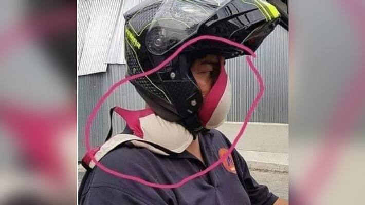 Malaysian man covers face with bra to protect from smoke on road Malaysian man covers face with bra to protect from smoke on road