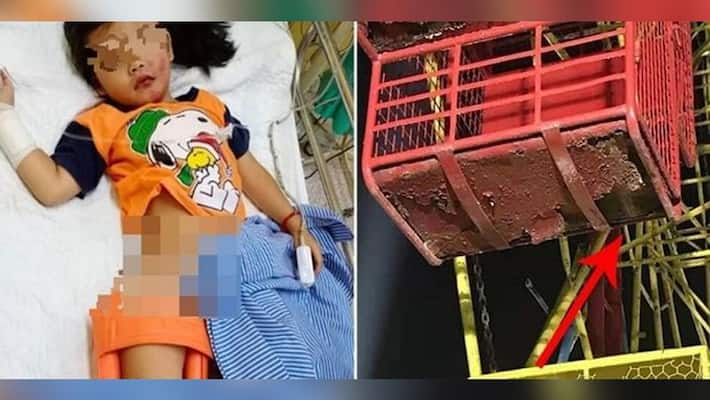 The girl went to the swing in the fair, then the open door and painful accident happened The girl went to the swing in the fair, then the open door and painful accident happened