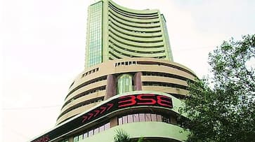 Auto and metal stocks gain; equity indices lay largely flat