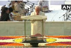 Prime Minister Narendra Modi pays tribute to Rajghat, Sonia also pays homage