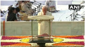 Prime Minister Narendra Modi pays tribute to Rajghat, Sonia also pays homage