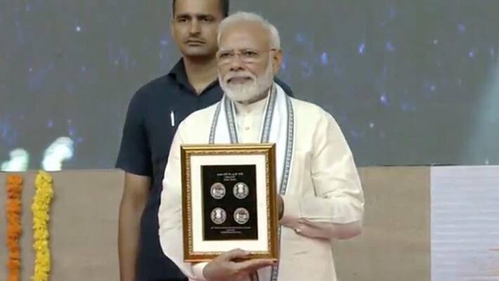 Narendra Modi releases commemorative Rs 150 coins Narendra Modi releases commemorative Rs 150 coins