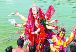 People from other religious community pelt stones at youth partaking in Durga idol procession; eight held