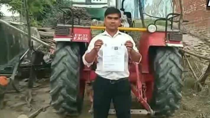 A tractor driver was issued a challan for not wearing a helmet in haryana A tractor driver was issued a challan for not wearing a helmet in haryana