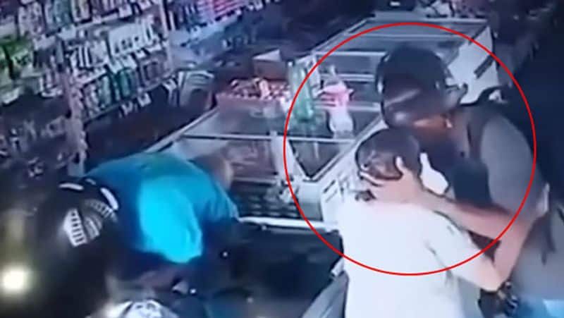 pharmacy robber takes mercy on elderly shopper and kisses