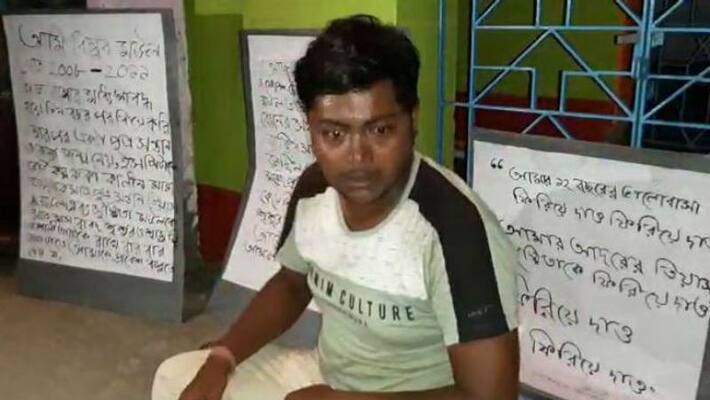 Young man sits on agitation to take home back his wife and son Young man sits on agitation to take home back his wife and son